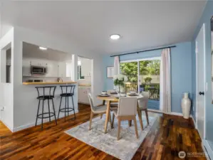 Dining area with access to back deck and attached garage to the right