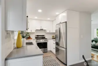 Sellers updated kitchen with new cabinets, countertops, appliances, lighting