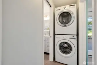 Well-located washer-dryer stack adjacent to sliding barn door