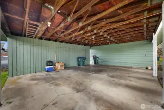 3 bay carport with individual storage attached to the duplex units.