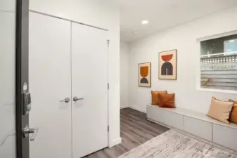 The huge entryway double closet. Notice the freshly painted interior and wood floors.