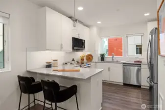 Freshly painted, the chef's kitchen is light and bright. Stainless appliance package and a brand new new Microwave.