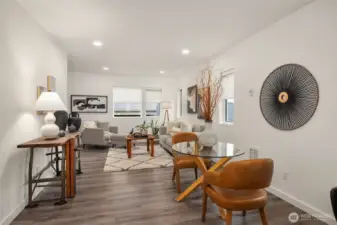 The open living room space can handle a lot of seating. All of the windows have custom blinds.