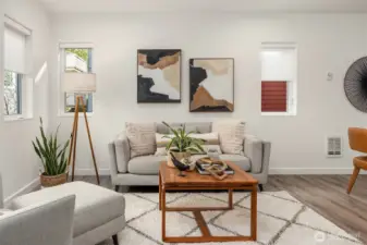 Plenty of room for a bigger sofa and/or more seating in this living room.