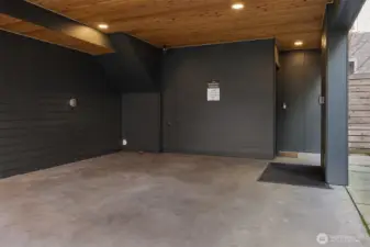 The private, covered parking is roomy enough for storage, and conveniently covered for your walk to the front door entry.