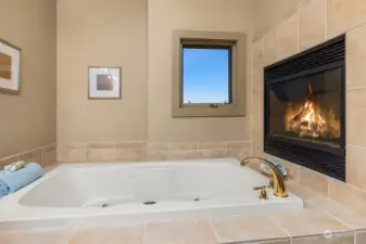 Relax and enjoy the jetted tub, and the see-through fireplace.