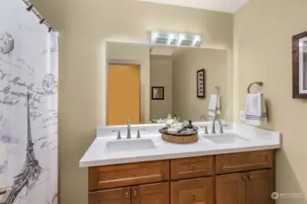 Newly refreshed bath vanity with large lighted-mirror in the junior suite bath.