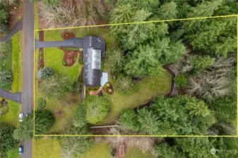 An overhead shot of the property... yellow outlines the boundary lines. White on the backside of the roof is moss treatment and will rinse off in time with rain.