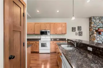 Expansive slab granite countertops add an elegant touch.