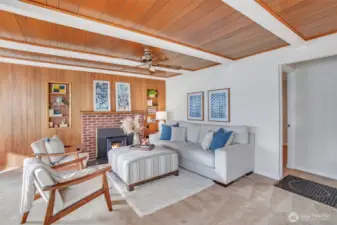 Beautiful wood planked wall and ceiling accents adorn the living room.