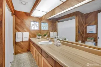 Main floor full bath has ample storage space for all your personal needs.