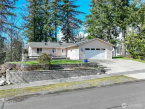 Front of home with retaining wall