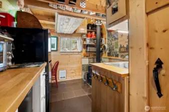 Kitchen ahead, half bath to the right.