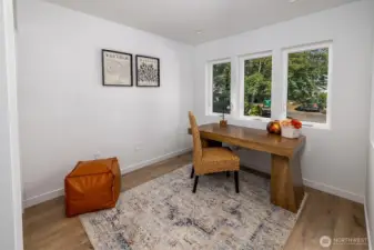Sweet office space, or bedroom on the main floor overlooks the generous front yard.