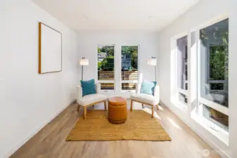 This picture doesn't do the space justice, but imagine an oversized reading nook off of your living room surrounded by lush forested views...that's what you've got here.
