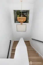 Dramatic stairway lighting leading up to the top floor.