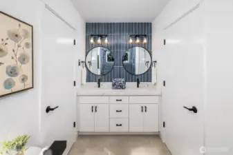 Jack and Jill styled bathroom accessible from each of the two top floor bedrooms (excluding the primary ensuite).  Full tile in both the sink and shower make this a show stopper!!