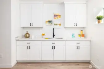 Wet bar, kitchen area in lower level daylight basement.