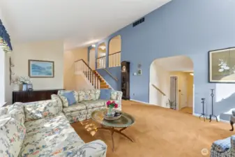 Another view of the living room. Stairs leading to bedrooms.