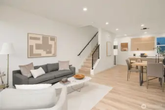 The dining space is conveniently located near the stairs, which lead to the private upper-level retreats.