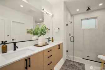 Paired with a luxury en-suite bath, features full tile surround + rainfall showerhead!