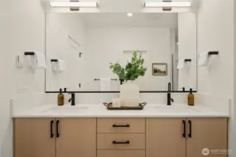 Dual vanity keeps things organized and convenient for primary residents