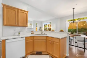 The heart of the home—this spacious kitchen features plenty of counter space and a breakfast bar for casual meals or entertaining.