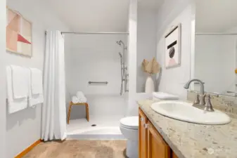 Indulge in the primary bath, complete with a spacious walk-in shower, granite countertops, and modern dual sinks