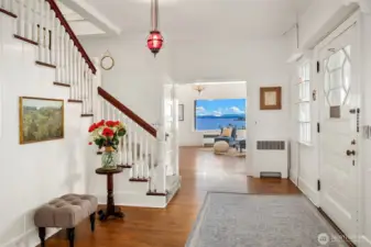 Foyer, front door on the right. Upon entry take a right to the expansive living room that overlooks the Puget Sound or left to the formal dining room.