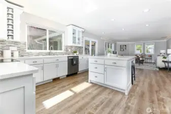 The chef-inspired kitchen opens seamlessly to the family room, creating a connected and welcoming space ideal for entertaining and everyday living.