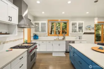 Oversized Quartz seating Island, and subway tile backsplash.