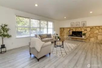 Large living room with wood burning fireplace