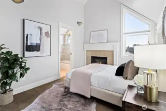 The primary bedroom is one of two en suite bedrooms on the upper level.