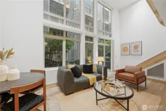 Soaring ceilings from this fabulous two-story loft style home with west facing patio drenched in natural light!