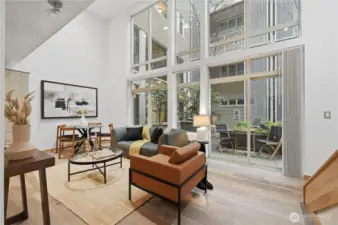 Check out this gracious open living area with walls of windows leading to your patio for ultimate entertaining!