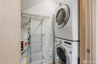 Laundry/storage room off main entry for convenience.