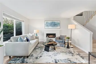 The living space is a perfect blend of comfort, tranquility and functionality, with light soothing colors and a brick wood-burning fireplace as the center piece of this room.