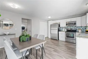 The open kitchen and dining nook creates an effortless flow between the two spaces, great for ease of serving up delish meals right from the stove top to the dinner table. The discreet closet in the corner has the Washer/Dryer and water heater unit.