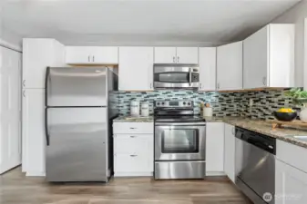 Chefs can move with ease in this open kitchen space and enjoy all the ample cabinetry storage space.