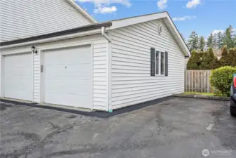 Such a delightful convenience of having a secured parking garage, additional storage space and a designated parking space. Parking is also allowed in front of the detached garage for additional parking.