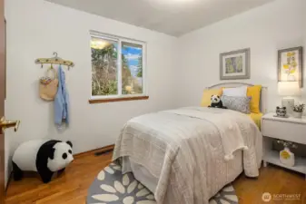 Sunny secondary bedroom ideal for guests, a home office, or creative space.