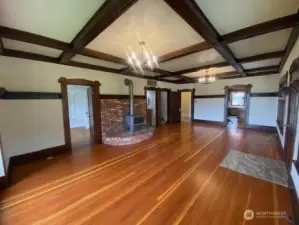 Large living room with beautiful original wood floors.