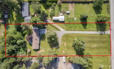 Almost 2 acres of space with home set way back on the lot.