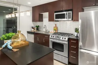 The functional kitchen with stainless steel appliances.