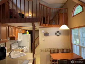 Looking into the kitchen area. Open loft upstairs