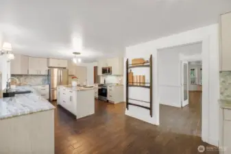 Entertain guests and never miss a conversation. This kitchen is the hub of this home. Show off your collection of Charcuterie boards or vintage platters on this built in rack.