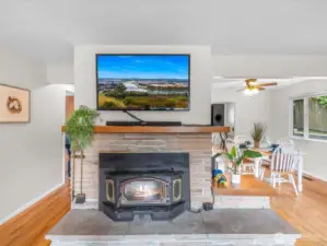 Nestled in the heart of the living space, this cozy wood stove adds both charm and function—perfect for curling up on chilly Pacific Northwest evenings.