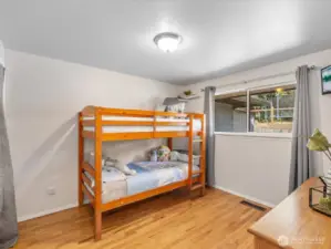 Generously sized and filled with natural light, this secondary bedroom offers endless versatility—perfect as a guest room, home office, or cozy retreat.