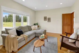 A spacious family room is adjacent to the great room