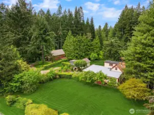 A look at most of the property, it extends into the woods to the left and in the back. Set back from the road for a peaceful, quiet site.